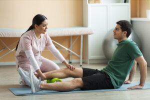 doctor-helping-patient-rehabilitation